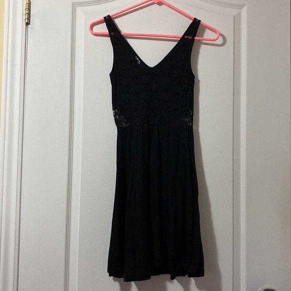 Black mini dress with lace back and lace side detail. - Picture 2 of 7